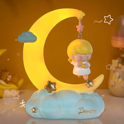LX EMPIRE Good Night Little Angel night light with a girl holding a moon on a crescent moon, stars, and clouds. Resin and plastic.