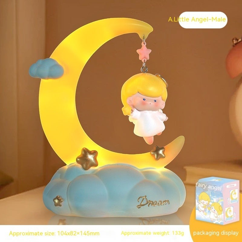 LX EMPIRE Little Angel night light with a yellow crescent moon, blue clouds, and stars. Features a hanging angel figurine.