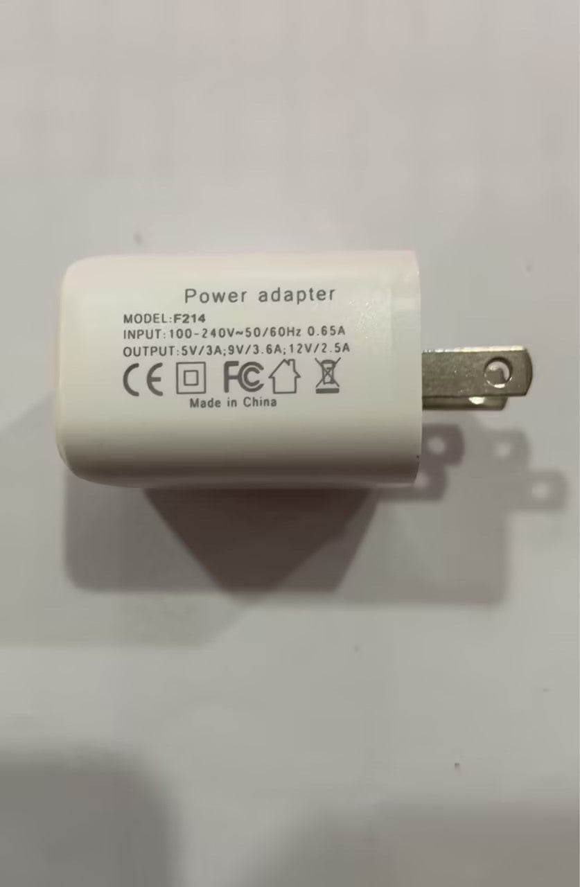 LX EMPIRE white power adapter with CE, FCC, and house symbols. Model F214.