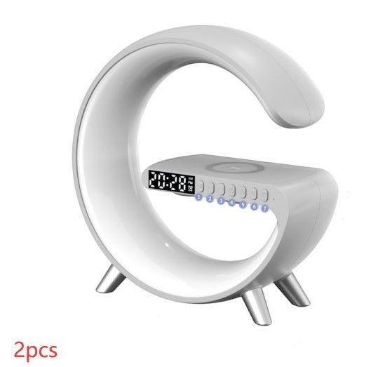 LX EMPIRE white G-shaped LED atmosphere lamp with digital clock, wireless charger, and Bluetooth speaker.
